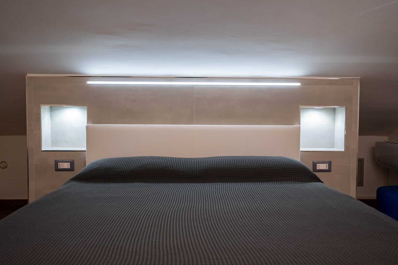 Zeus Room, double bed headboard with soft lighting